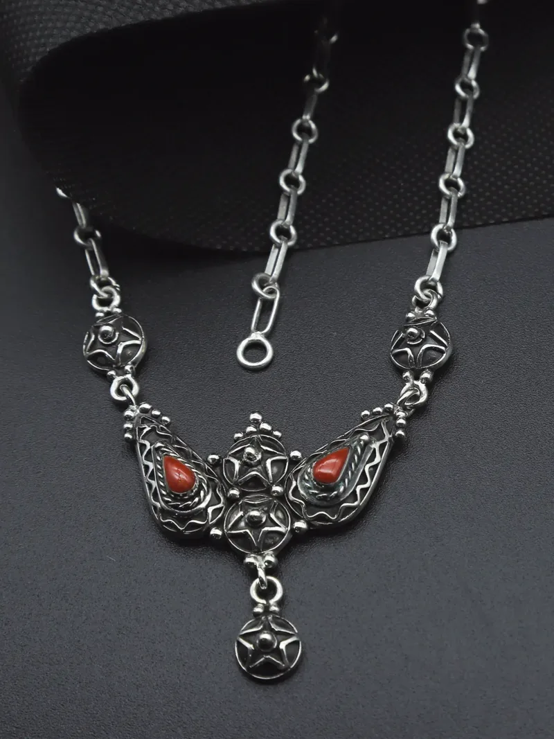 Artisan Silver Necklace – Handcrafted Curves with Red Coral Accents
